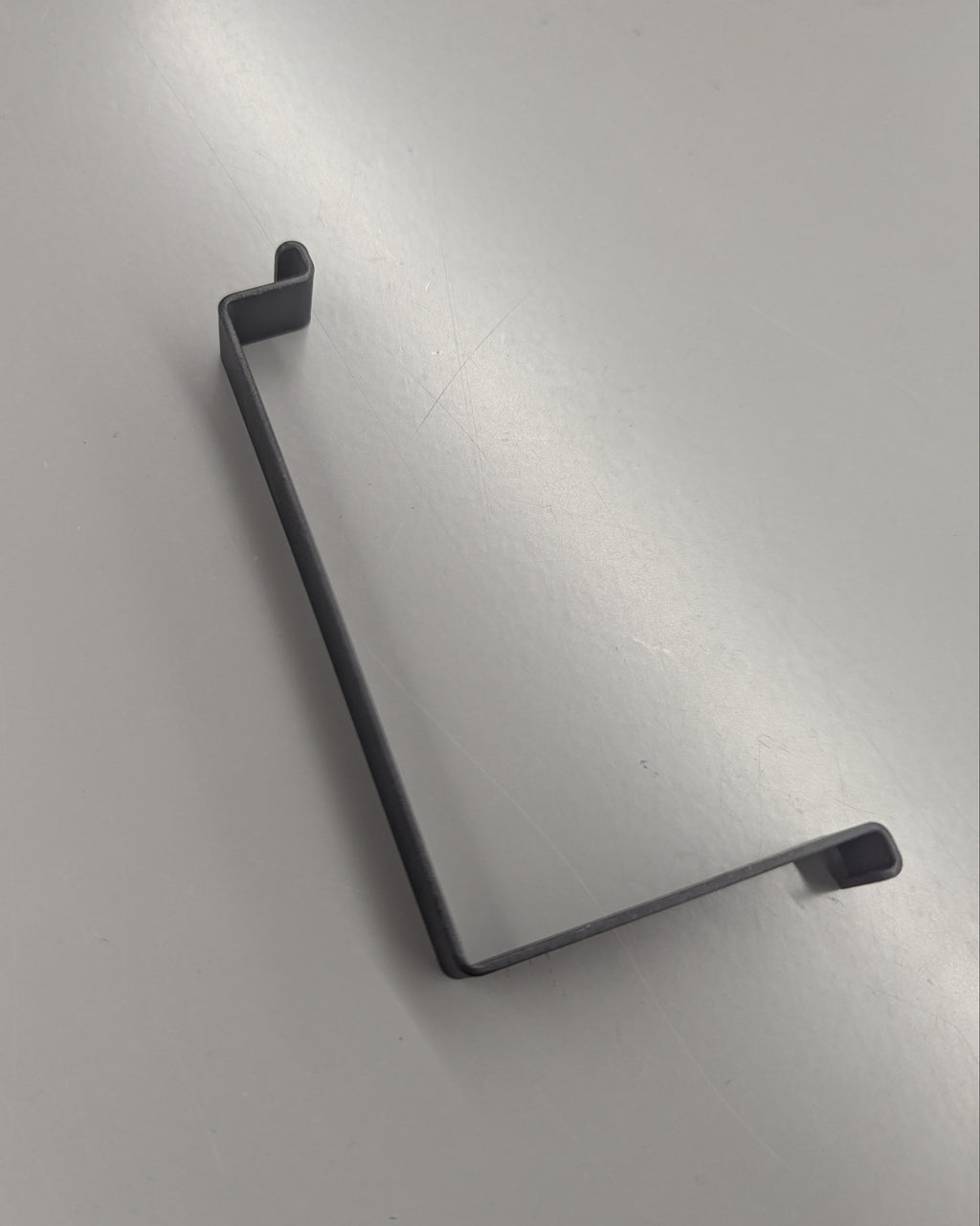 BRACKET, BATTERY STRAP (Y1033.10B5 Rev A)