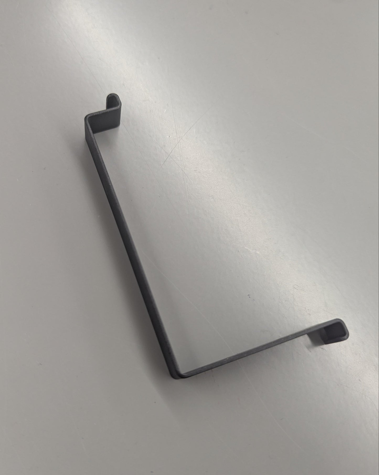 BRACKET, BATTERY STRAP (Y1033.10B5 Rev A)